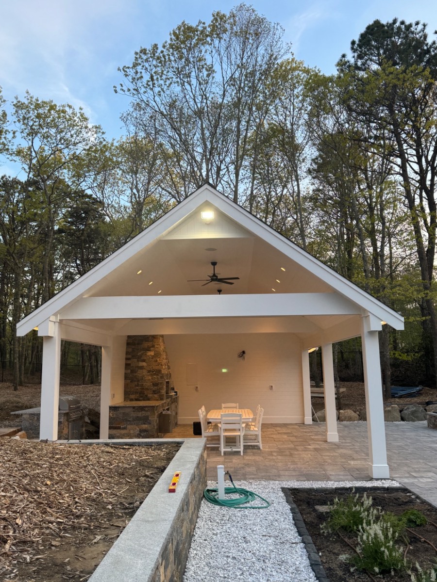 Custom pool house pavilion with stone fireplace