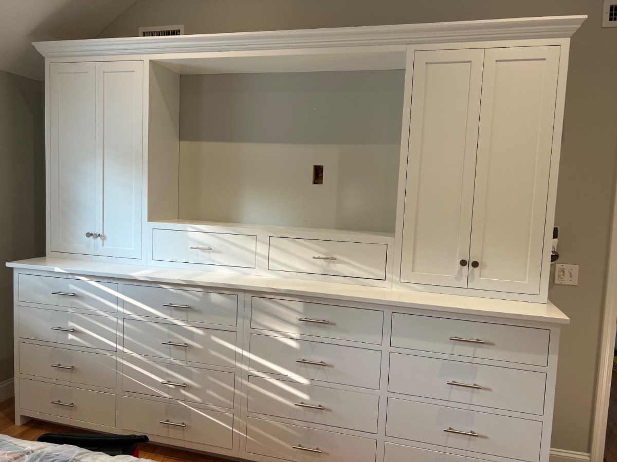 Custom white kitchen with pro range and farmhouse sink